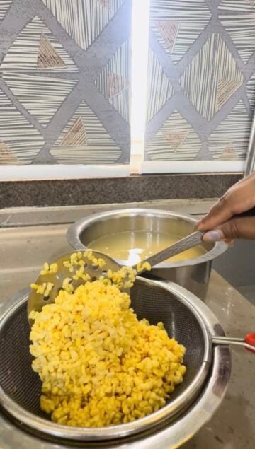 Straining water from soaked dal
