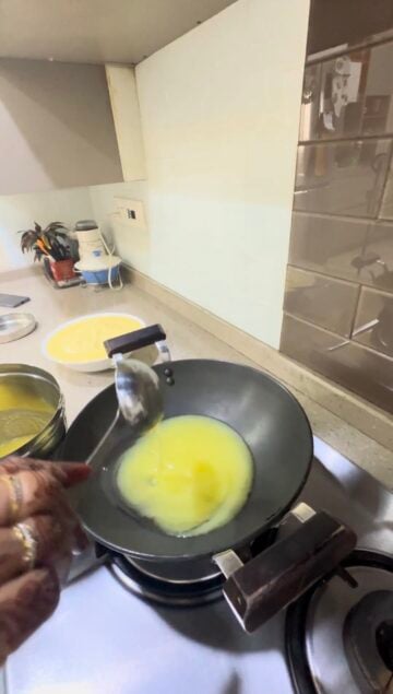 Adding ghee to wok
