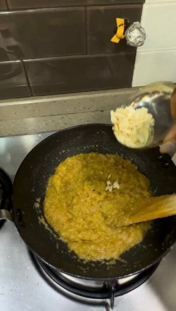 Almonds being added to Moong Dal Halwa